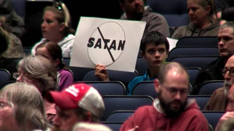 Hundreds of parents applaud the school board for blocking the after-school Satan Club